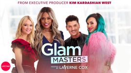 Host Laverne Cox along with judges Kandee Johnson, Zanna Roberts Rassi and Mario Dedivanovic huddle in a line and stare into the camera in front of a white background.